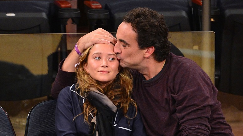 Olivier Sarkozy kissing Mary-Kate Olsen on the forehead