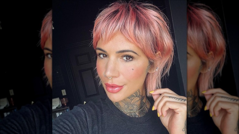 Woman with pink pixie cut