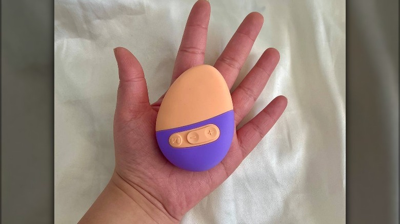 An Unbound sex toy in the palm of a hand