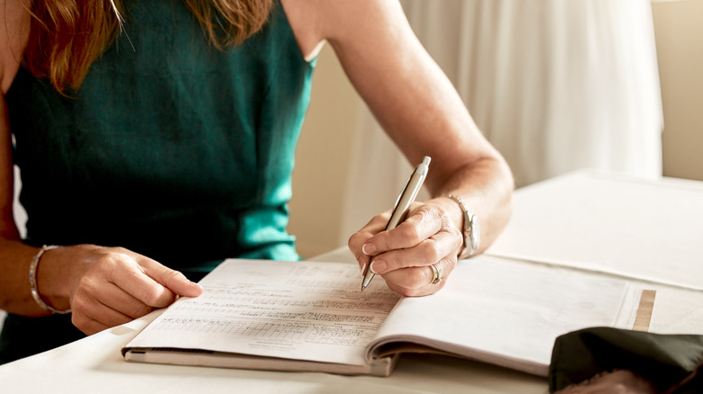 Woman writing wedding plans