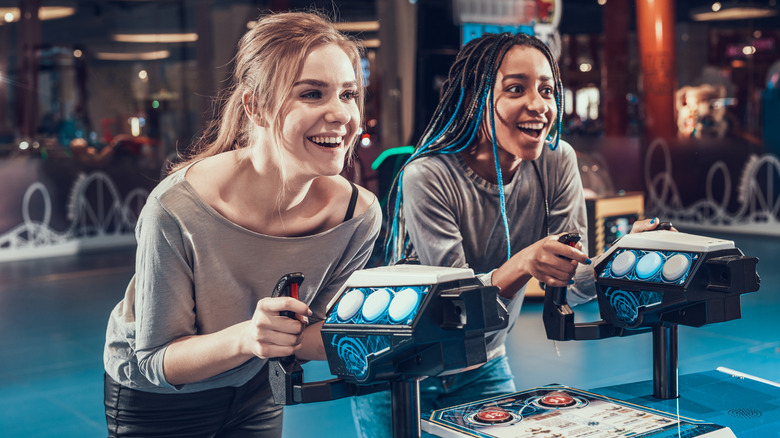 Women playing games at an arcade