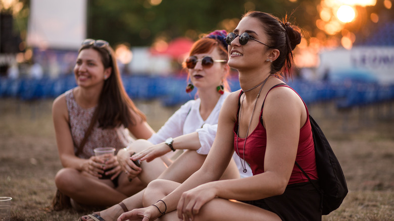 Women watching an outdoor concert