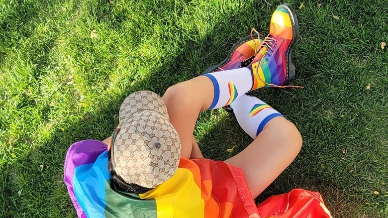 Person wearing rainbow Doc Martens 