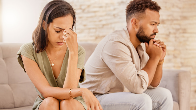 couple looking worried and stressed