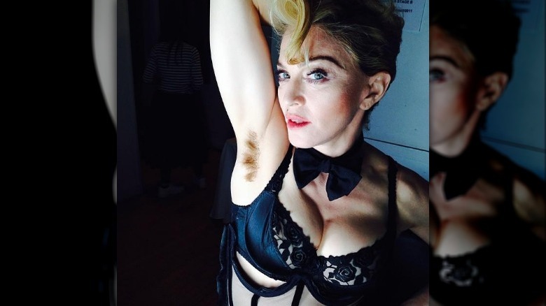 Madonna showing off her armpit hair