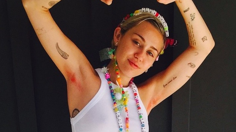 Miley Cyrus showing her armpits