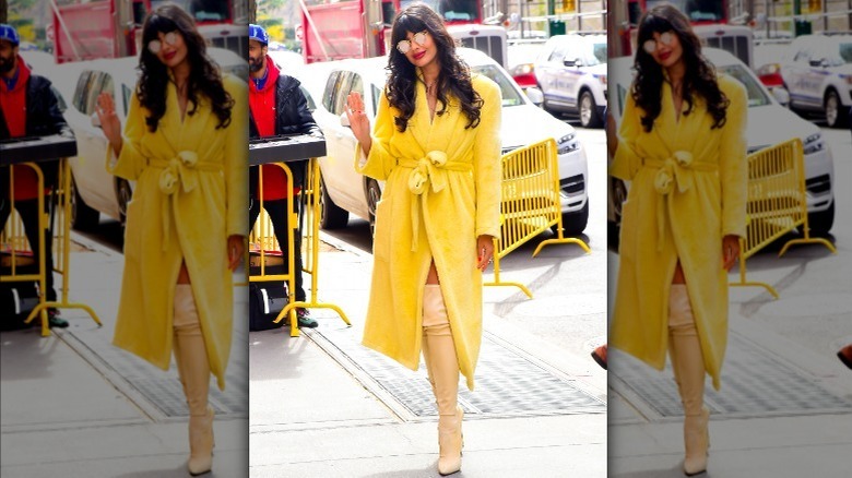 Jameela Jamil posing in a leopard-print dress with descriptions about her body all around the photo
