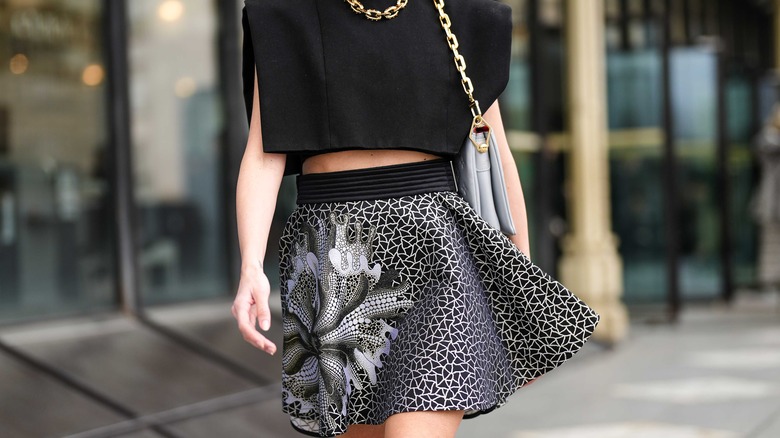 Woman in patterned miniskirt