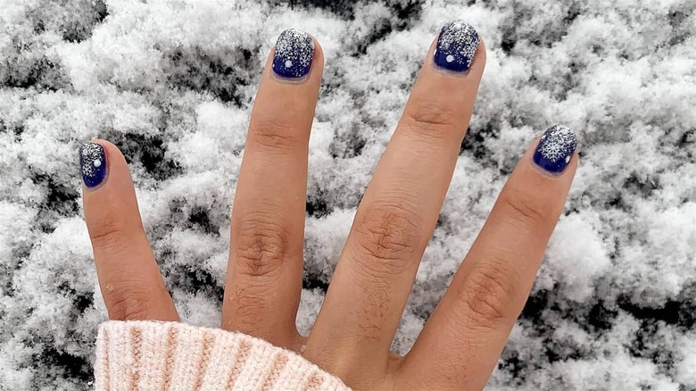 Dark blue manicure with dusting of snow