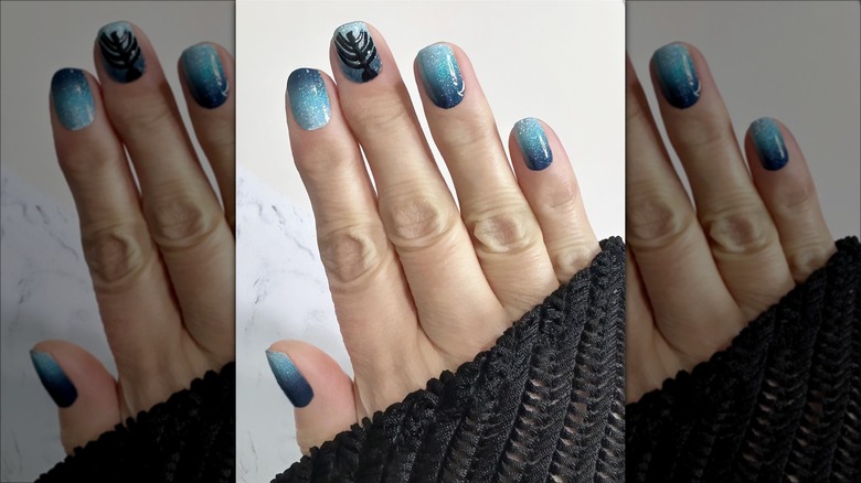 Gradient blue manicure with menorah