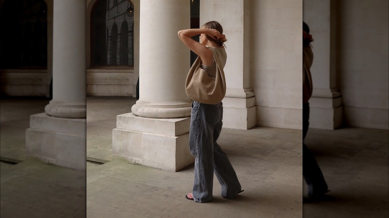 Woman with a slouchy bag