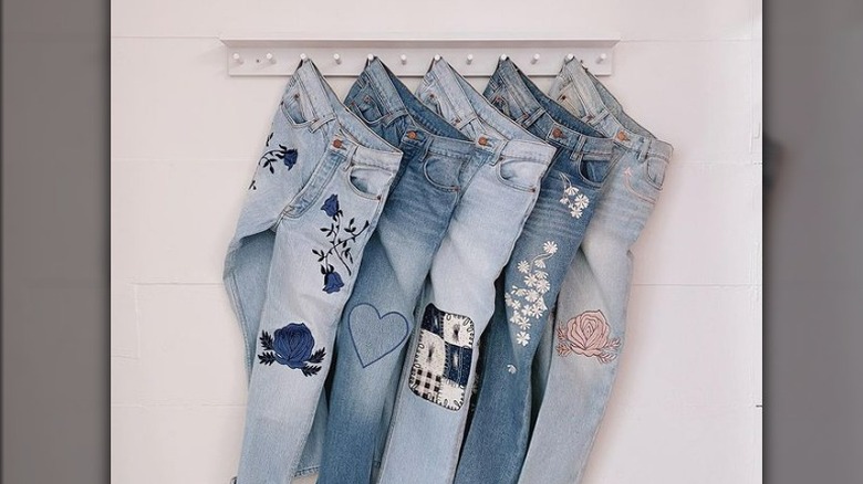 Four jeans on a hanger