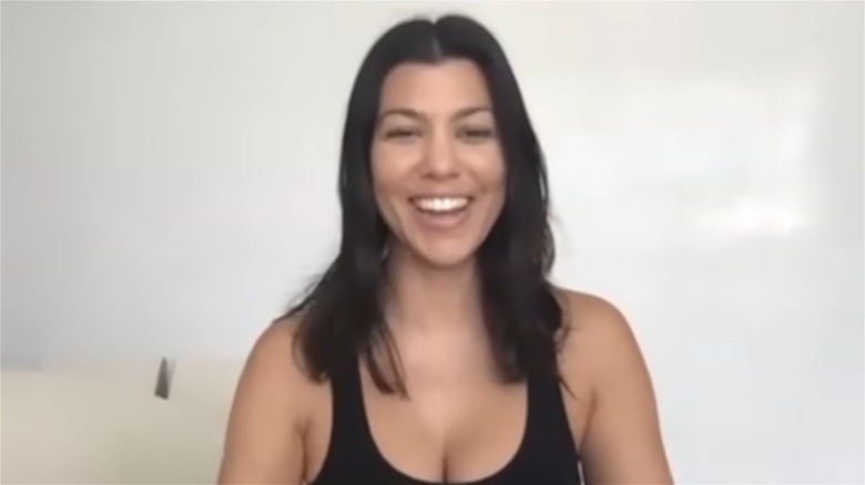 Kourtney Kardashian ith unstyled hair