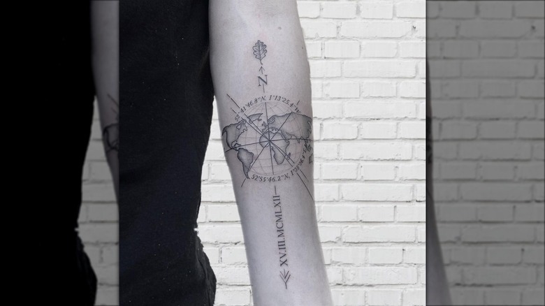 Globe and coordinates tattoo