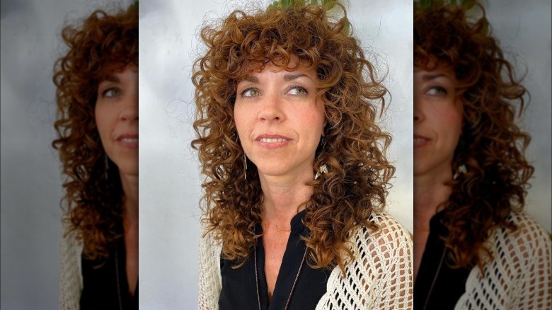 Woman with curly shag haircut