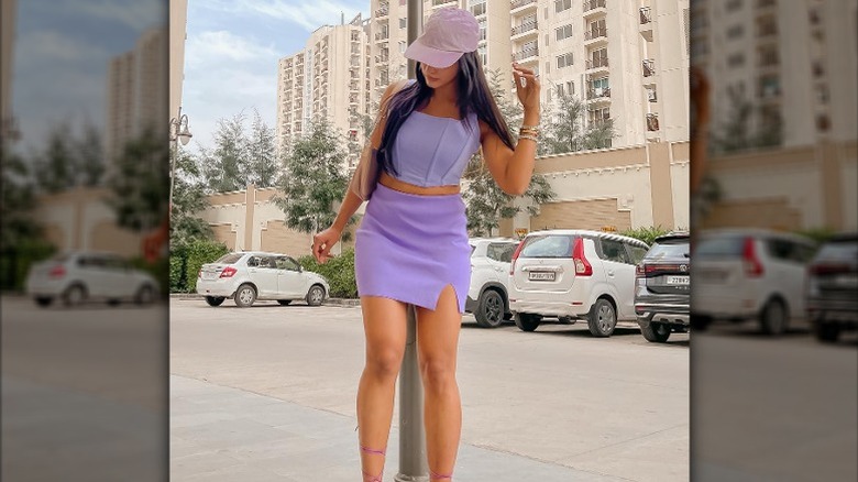 Woman in purple outfit