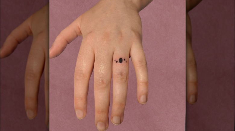 Dot ring tattoo