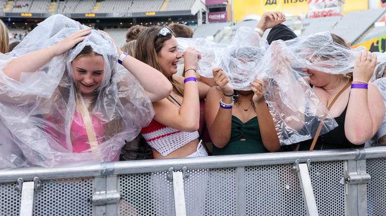 Girls at concert with ponchos