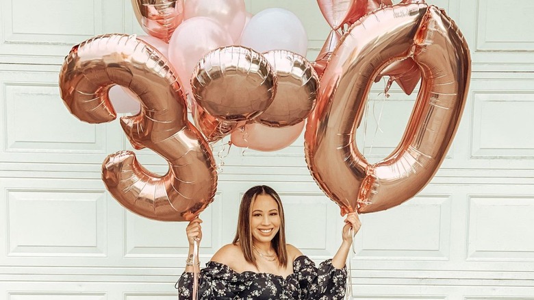 Woman with 30 balloons