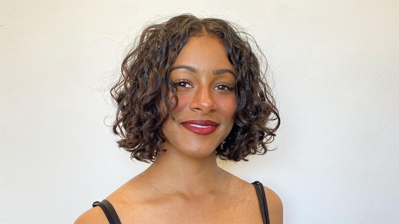 Woman with a curly bob