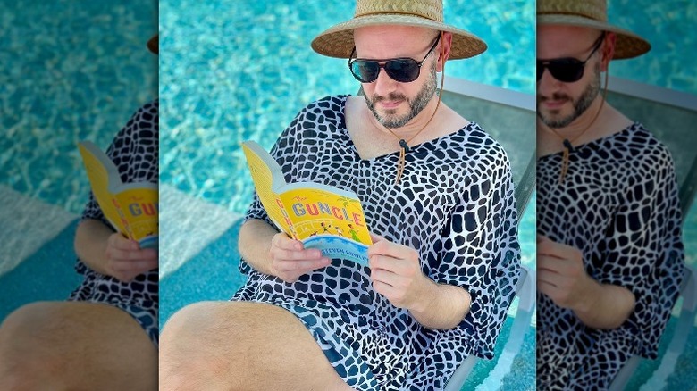 Steven Rowley  reading his book by the pool