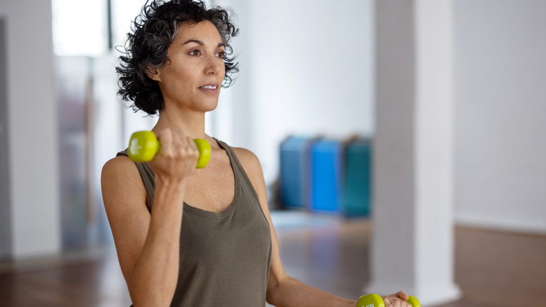 Older woman exercising with dumbbells