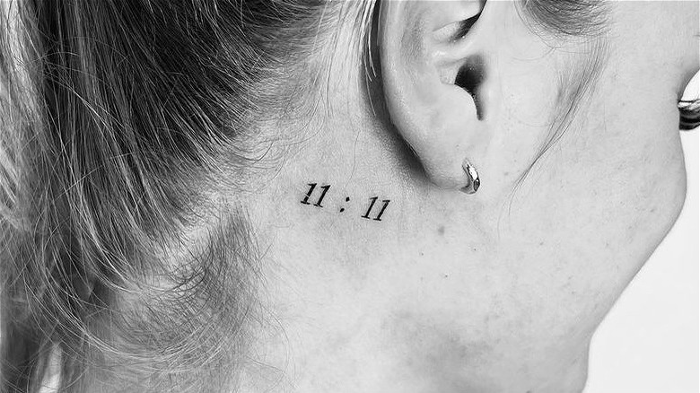 11:11 tattoo behind the ear