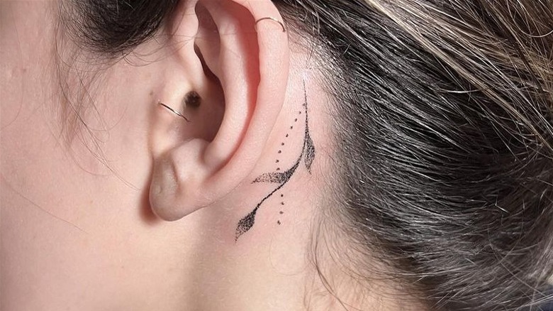 Leaf and dot tattoo