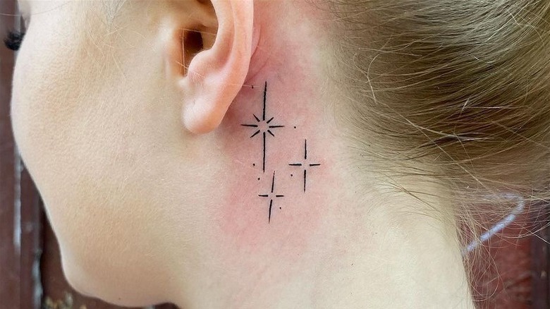 Stars behind the ear tattoo