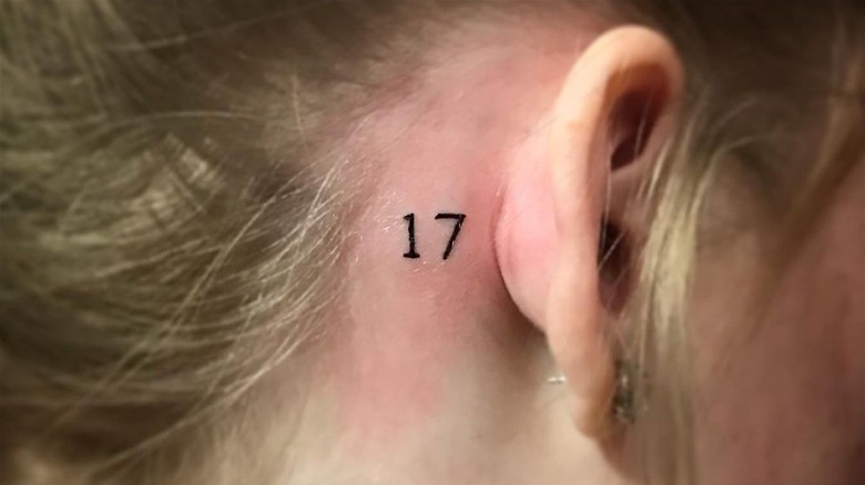 Number behind the ear tattoo