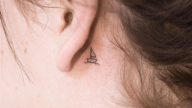 Behind the ear boat tattoo