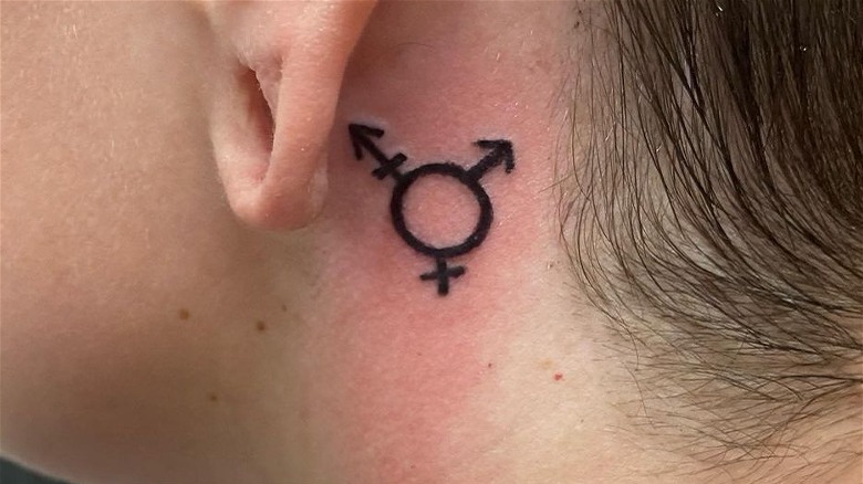 LGBTQ+ tattoo behind the ear