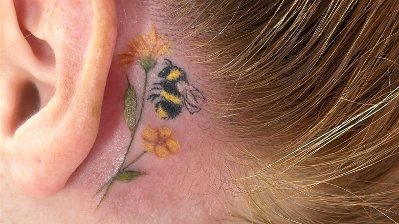 Bee and flowers tattoo