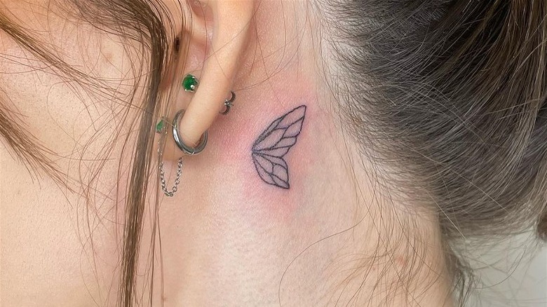 Half wings tattoo
