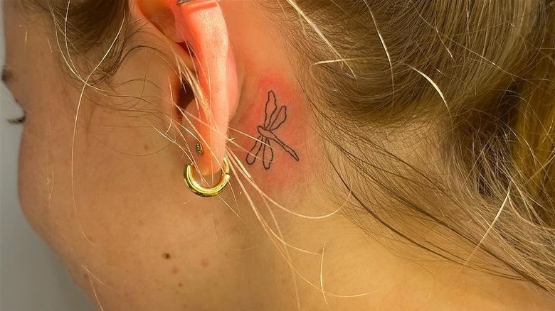 Behind the ear dragonfly tattoo