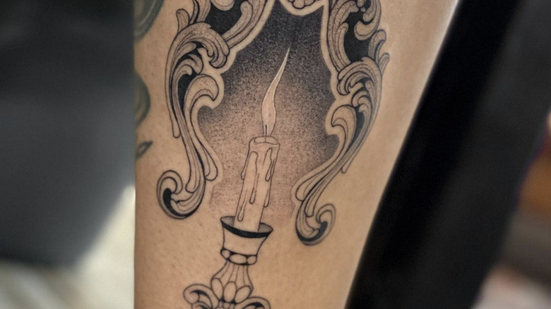 Tattoo of a candle and a flame