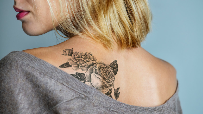 tattoo of roses on woman's back