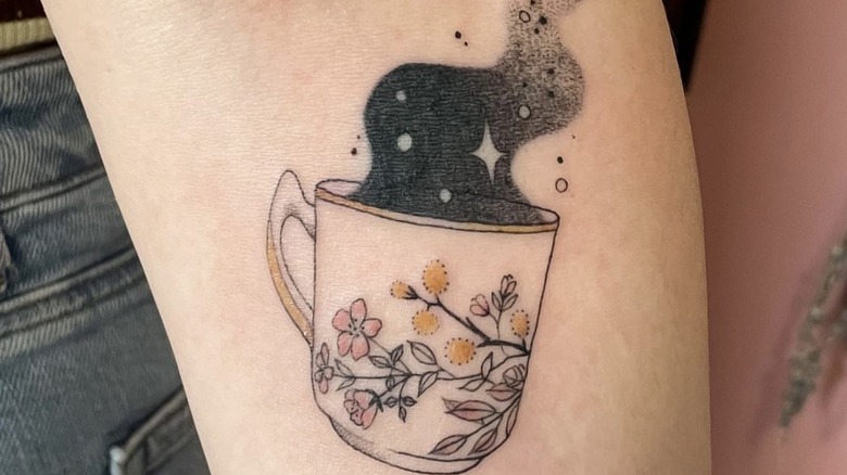 tattoo of mug with flowers 