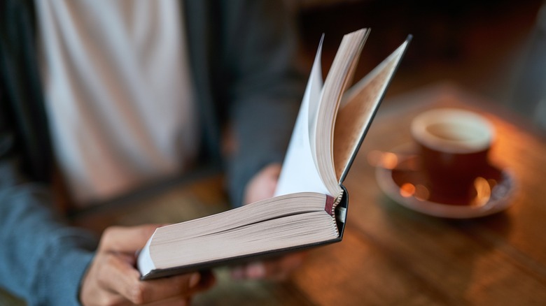 Person reading in coffee shop