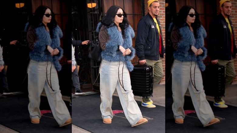 Paparazzi shot of Charli XCX wearing baggy jeans and Ugg boots