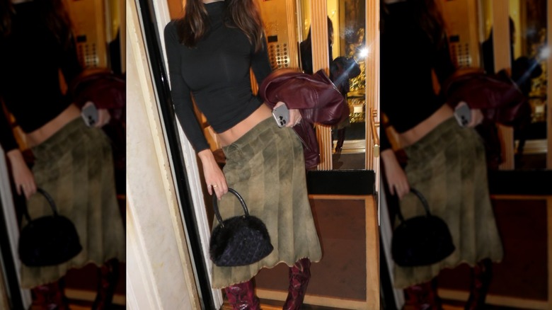 Emily Ratajkowski on Instagram in a green skirt and black cropped turtleneck