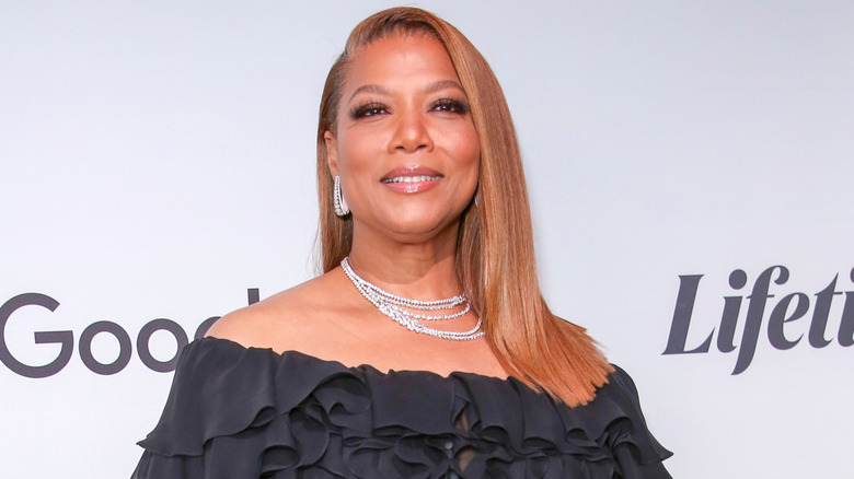 Queen Latifah smiling on the red carpet of a Lifetime television event