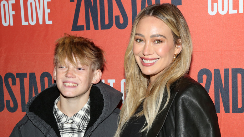 Hilary Duff poses with her son Luca Comrie at the opening night of Second Stage Theatre's new play "The Cult of Love" on Broadway at The Hayes Theater