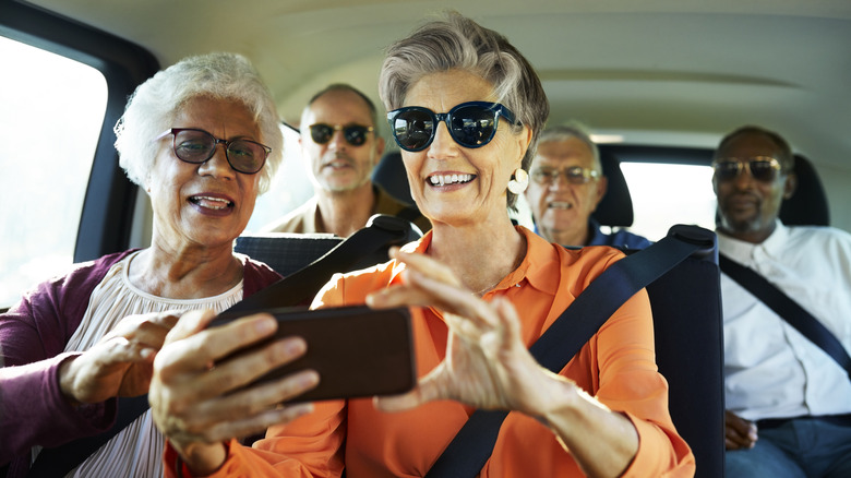 elderly people on an adventure posing for selfie