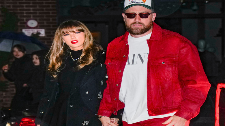 Taylor Swift and Travis Kelce pictured in New York City, with Swift wearing straight-across bangs