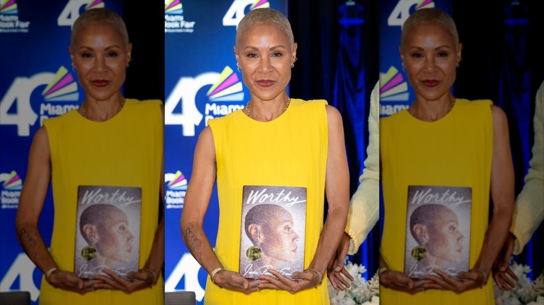 Jada Pinkett Smith holding her book