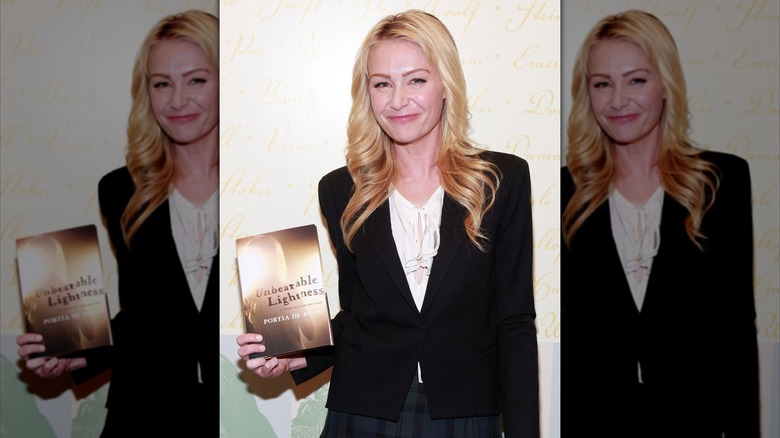 Portia de Rossi with her book