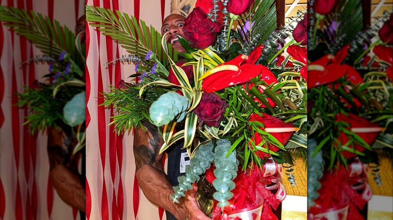 Dwayne Johnson holds bouquet of flowers