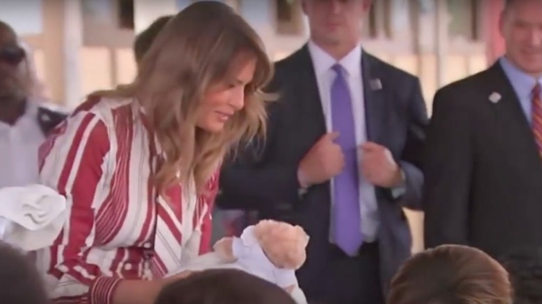 Melania Trump in Africa wearing a red dress