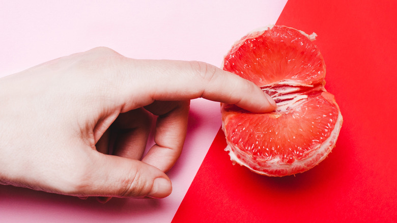 finger in grapefruit
